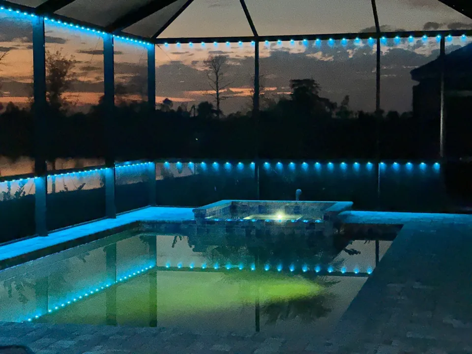 Pool cage in teal as the sun sets