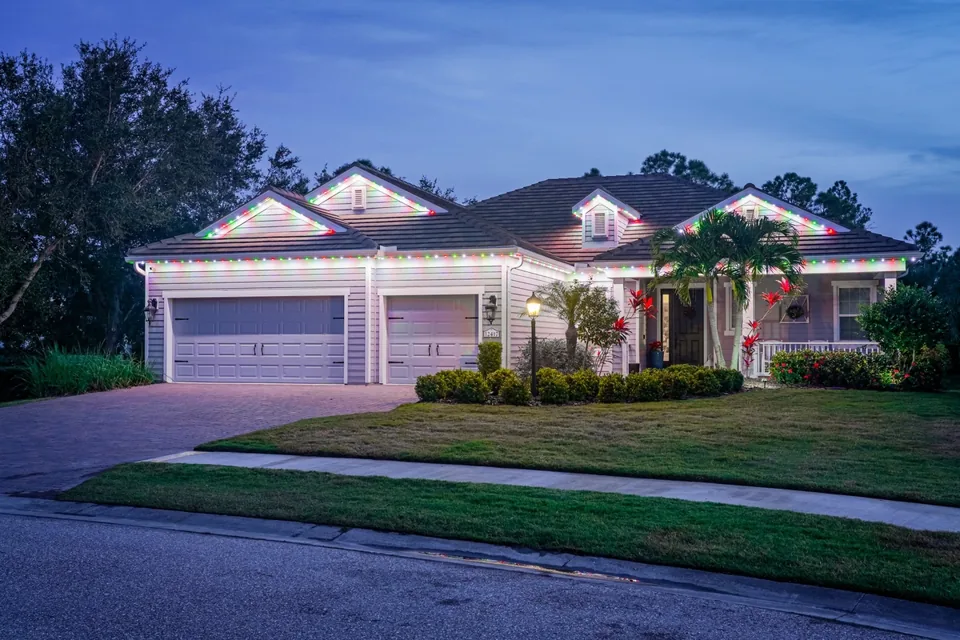 Another home with warm-white roofline lighting at dusk