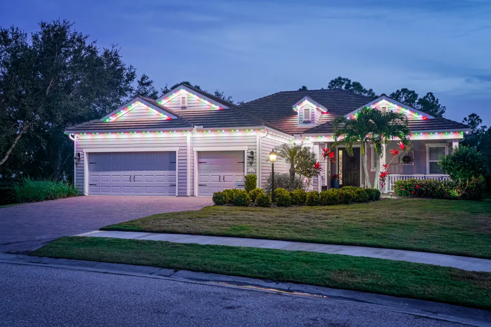 Home with warm-white soffit lighting at dusk