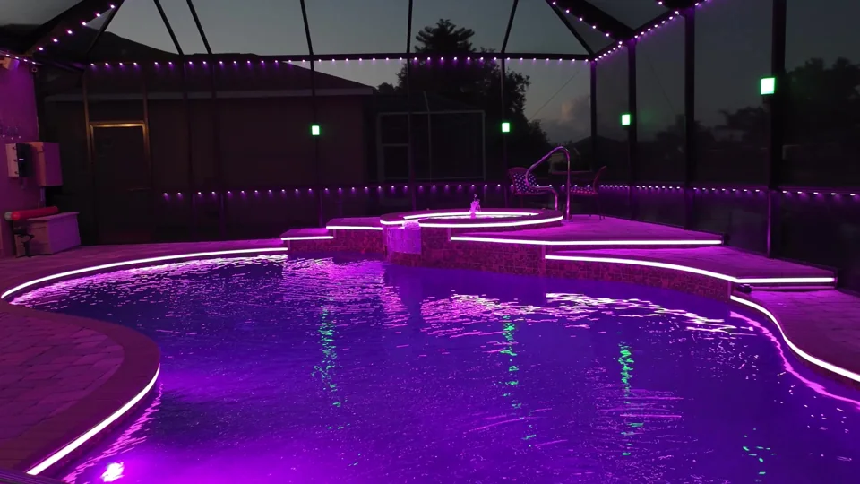 Pool steps and coping traced by one continuous magenta line of JellyFish Saber light