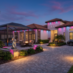 Modern home exterior illuminated by sleek, permanent landscape lights at dusk.