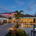 A modern home beautifully illuminated with elegant, permanent exterior lights.